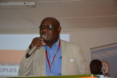 A GUEST PRESENTING TO DELEGATES DURING 10 TH AGM